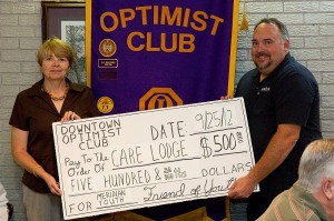rca_092512-9093-34 Care Lodge Director Leslie Payne is presented with a donation by DTOC President Eddy Chaney