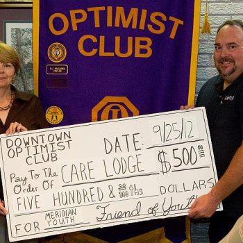 Care Lodge Director Leslie Payne Is Presented With A Donation By DTOC President Eddy Chaney