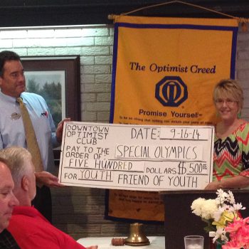 Former President Dan Derrington Presents The DTOC Special Olympics Donation To Kristie Anders