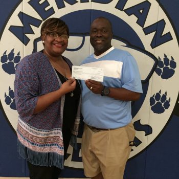 DTOC Member Brittany Kennedy Presents A Check To Coach Ron Norman